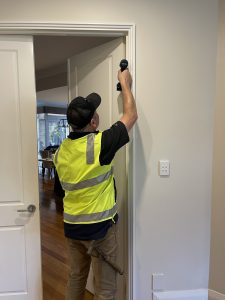 Carpenter installing interior doors & door handles in Joondalup Home - Perth Western Australia